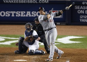 Detroit Tigers' Cabrera hits an RBI single in front of New York Yankees catcher Martin during the eighth inning of Game 2 of their MLB ALCS playoff baseball series in New York